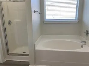 a white bath tub sitting next to a window