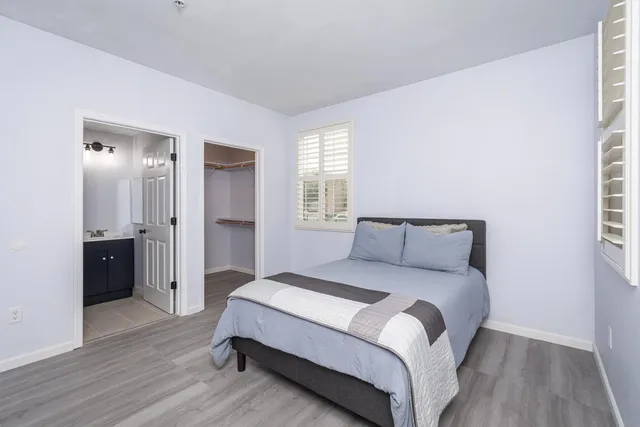 a bedroom with a bed and closet