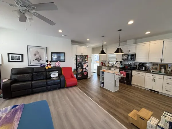 a living room with furniture kitchen and a kitchen view
