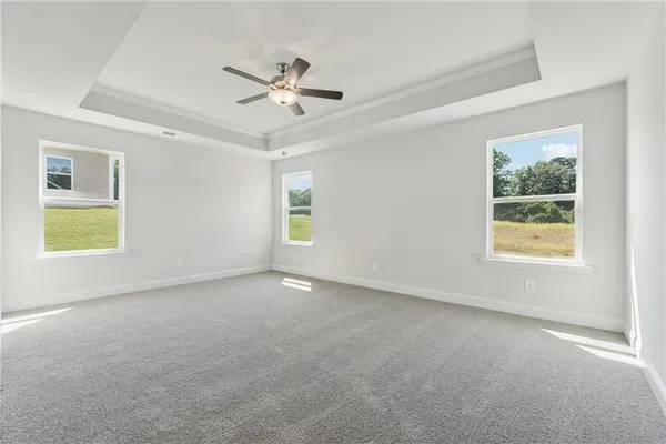a view of an empty room with a window