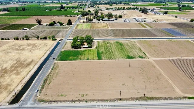 a view of swimming pool with a yard and plants
