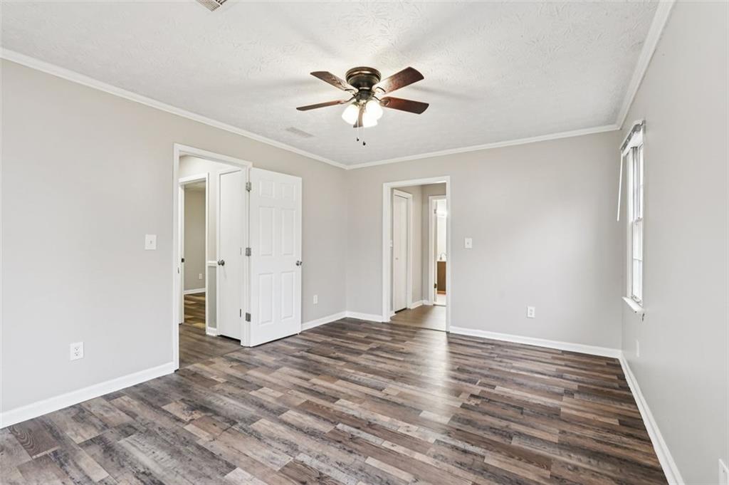 5151 Lilburn Stone Mountain Road Lilburn, GA 30047 - Photo 38 of 58 a view of an empty room with wooden floor