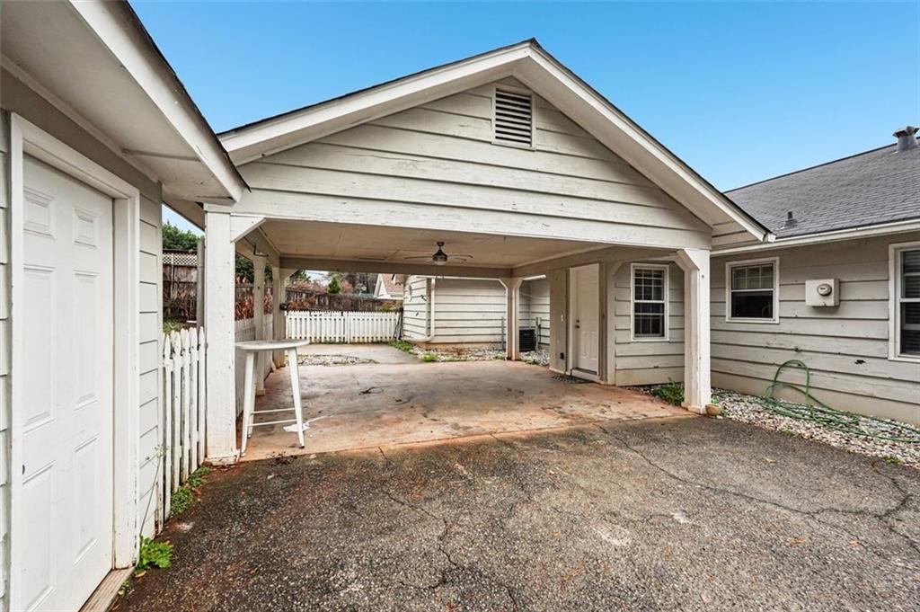 5151 Lilburn Stone Mountain Road Lilburn, GA 30047 - Photo 51 of 58 a view of the house with wooden fence