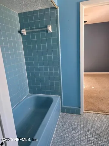 a bathroom with a bath tub