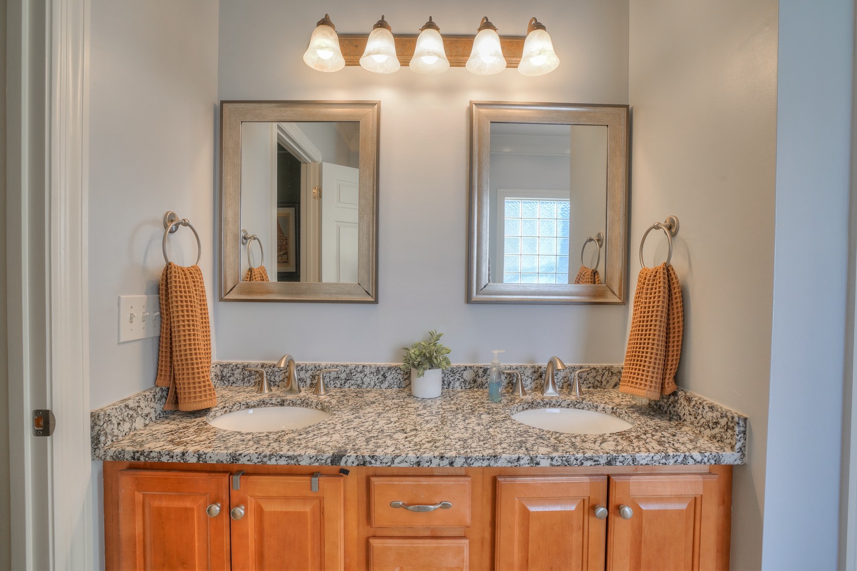 1211 Marathon Drive Murfreesboro, TN 37129 - Photo 25 of 37 a bathroom with sinks granite countertop and a mirror