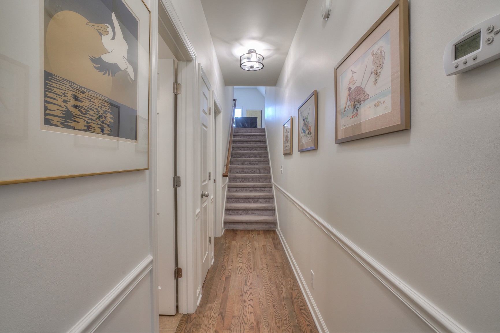 1211 Marathon Drive Murfreesboro, TN 37129 - Photo 32 of 37 a view of a hallway with stairs and wooden floor