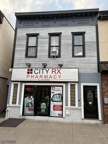 a front view of building with retail shop and window