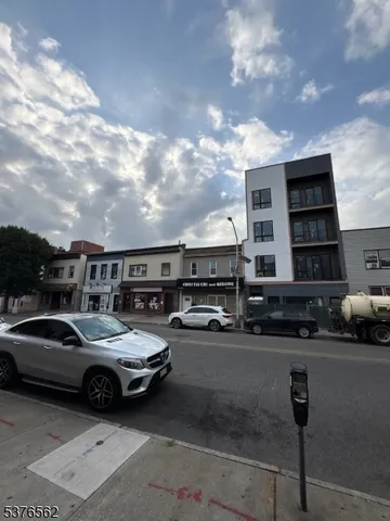 a view of parking space with multiple cars