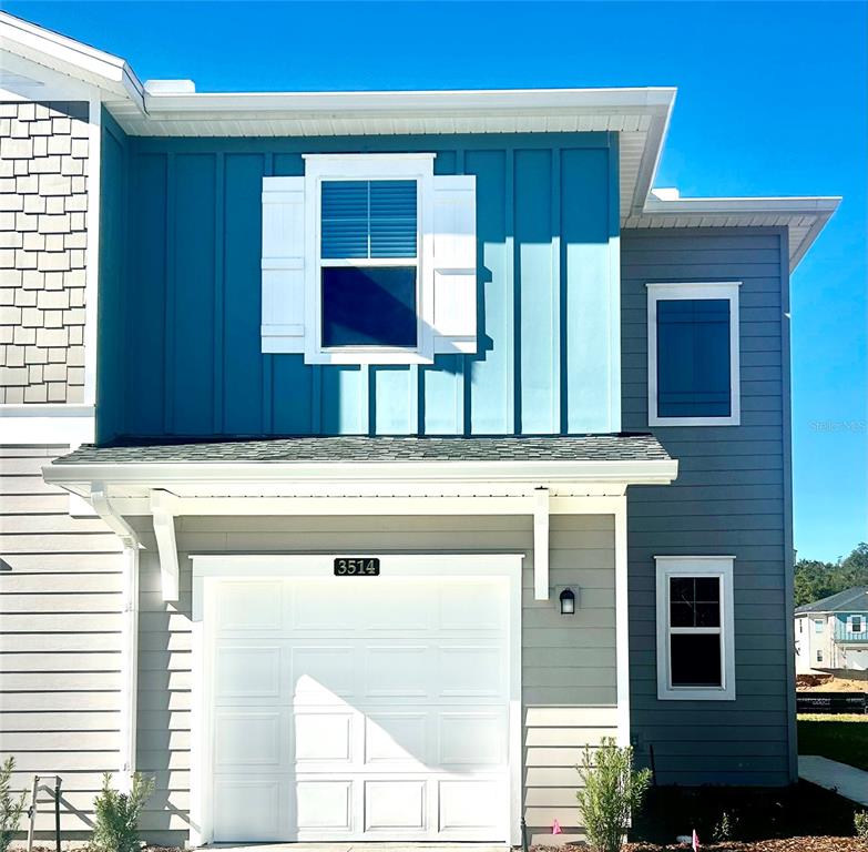 a view of kitchen with a sink and a window