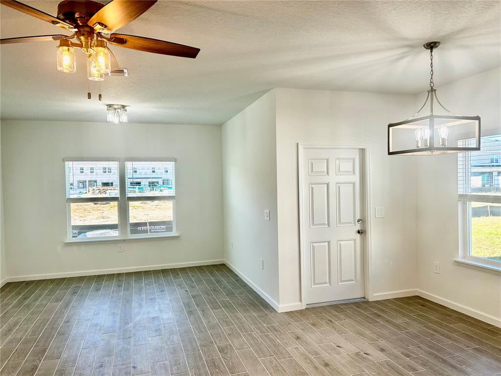3514 Southeast 37th Ave Road Ocala, FL 34480 - Photo 12 of 42 a view of empty room with wooden floor and fan