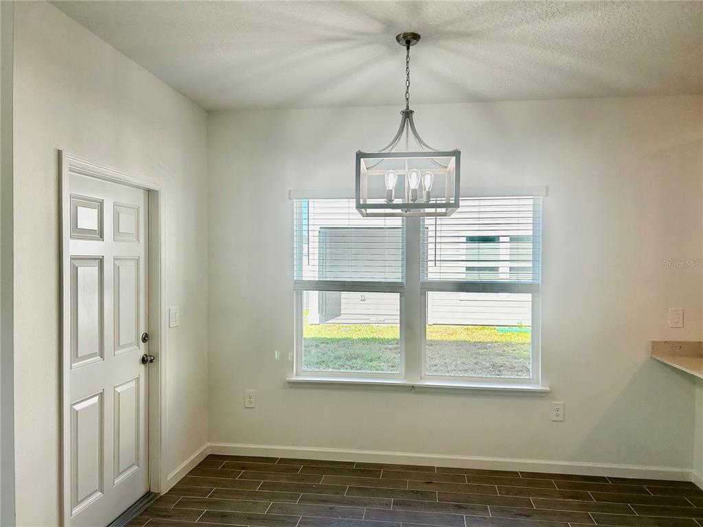 3514 Southeast 37th Ave Road Ocala, FL 34480 - Photo 14 of 42 a view of empty room with wooden floor and window
