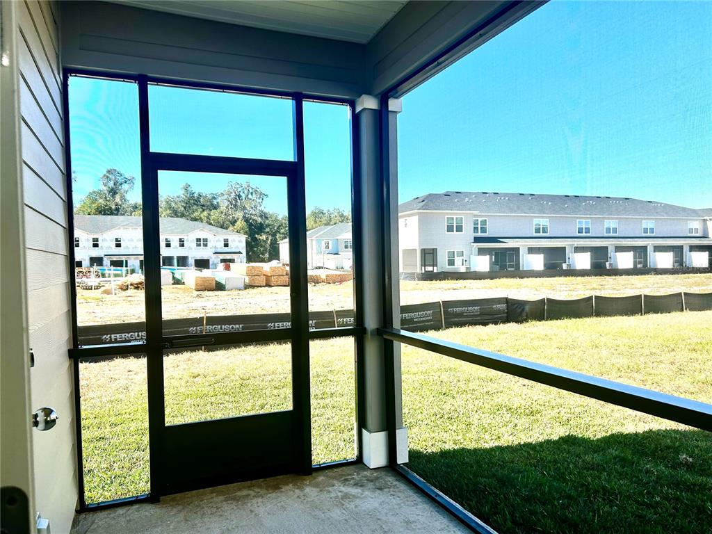 3514 Southeast 37th Ave Road Ocala, FL 34480 - Photo 39 of 42 a view of an outdoor kitchen with large windows
