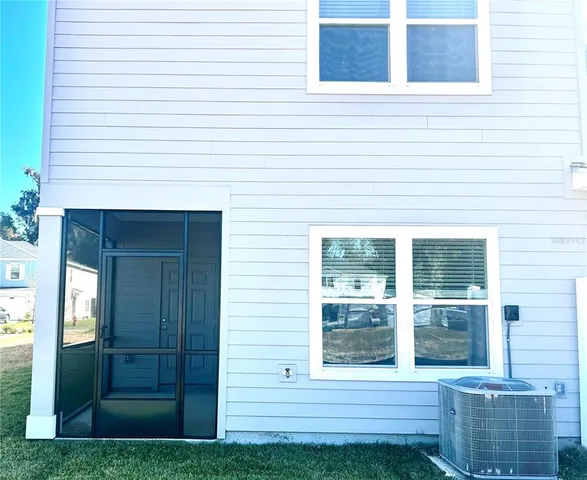 an entrance to house with yard