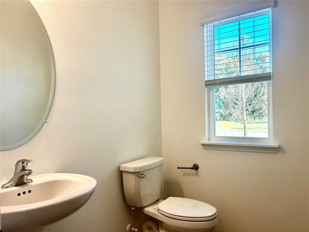 3514 Southeast 37th Ave Road Ocala, FL 34480 - Photo 9 of 42 a bathroom with a sink and a toilet