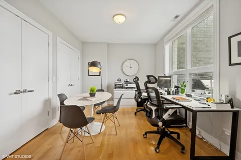 a view of a dining room with furniture and a window