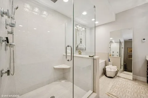 a bathroom with a shower a toilet and sink