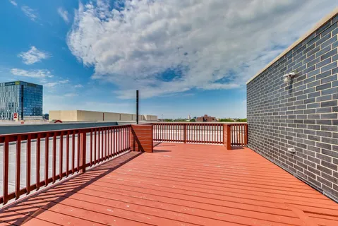 a view of balcony with wooden floor