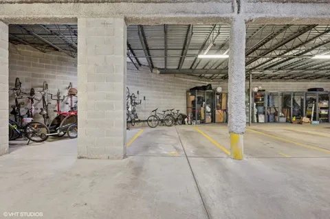 a view of a garage with a white house