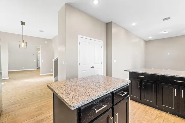 a kitchen with a sink and a refrigerator