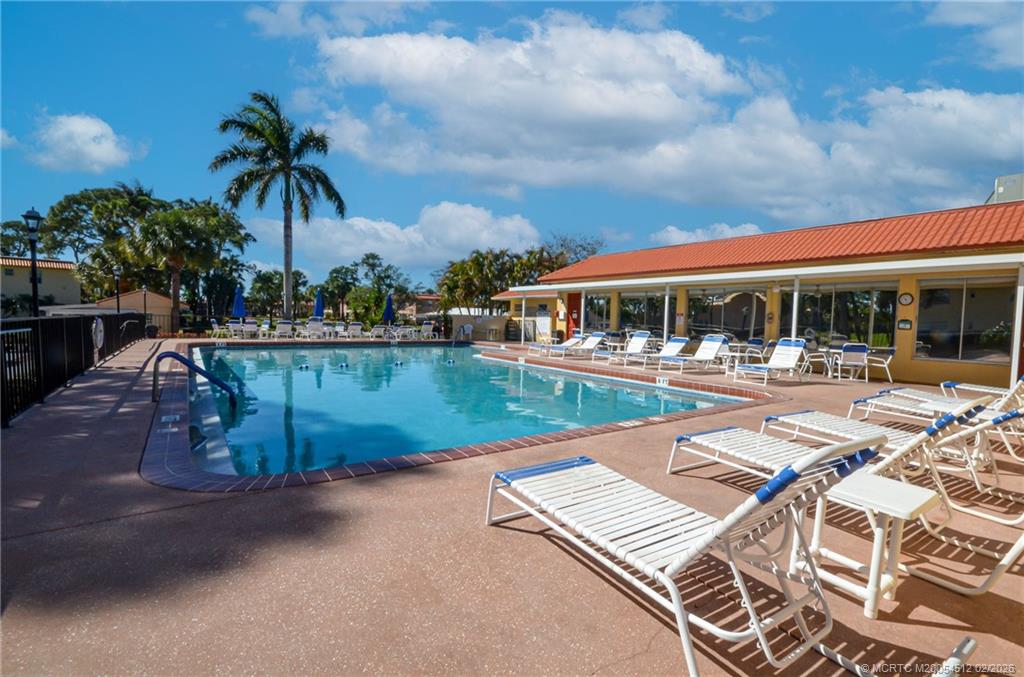 a view of a swimming pool with a patio
