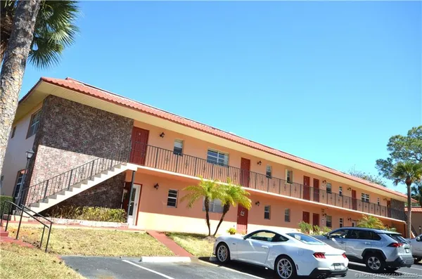 a front view of a building with street view