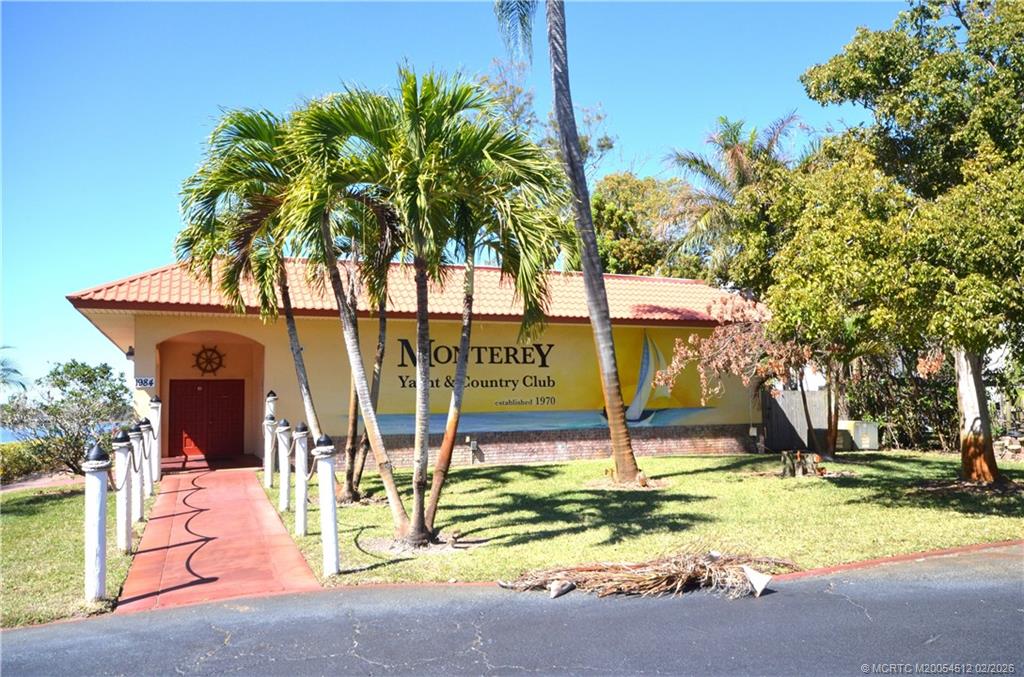1963 Southwest Palm City Road, Unit F Stuart, FL 34994 - Photo 18 of 19 a house with swimming pool in front of it