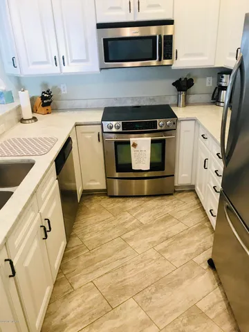 a kitchen with a stove and a microwave
