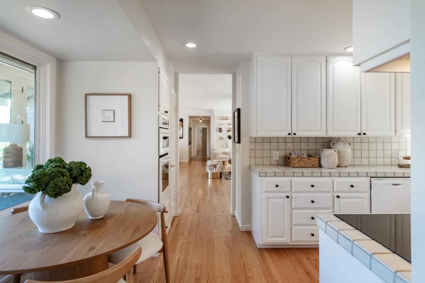 600 Westridge Drive Portola Valley, CA 94028 - Photo 12 of 22 a kitchen with stainless steel appliances kitchen island granite countertop a sink cabinets and wooden floor