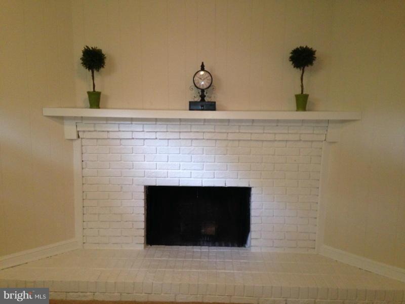 a close view of a fireplace with wooden floor