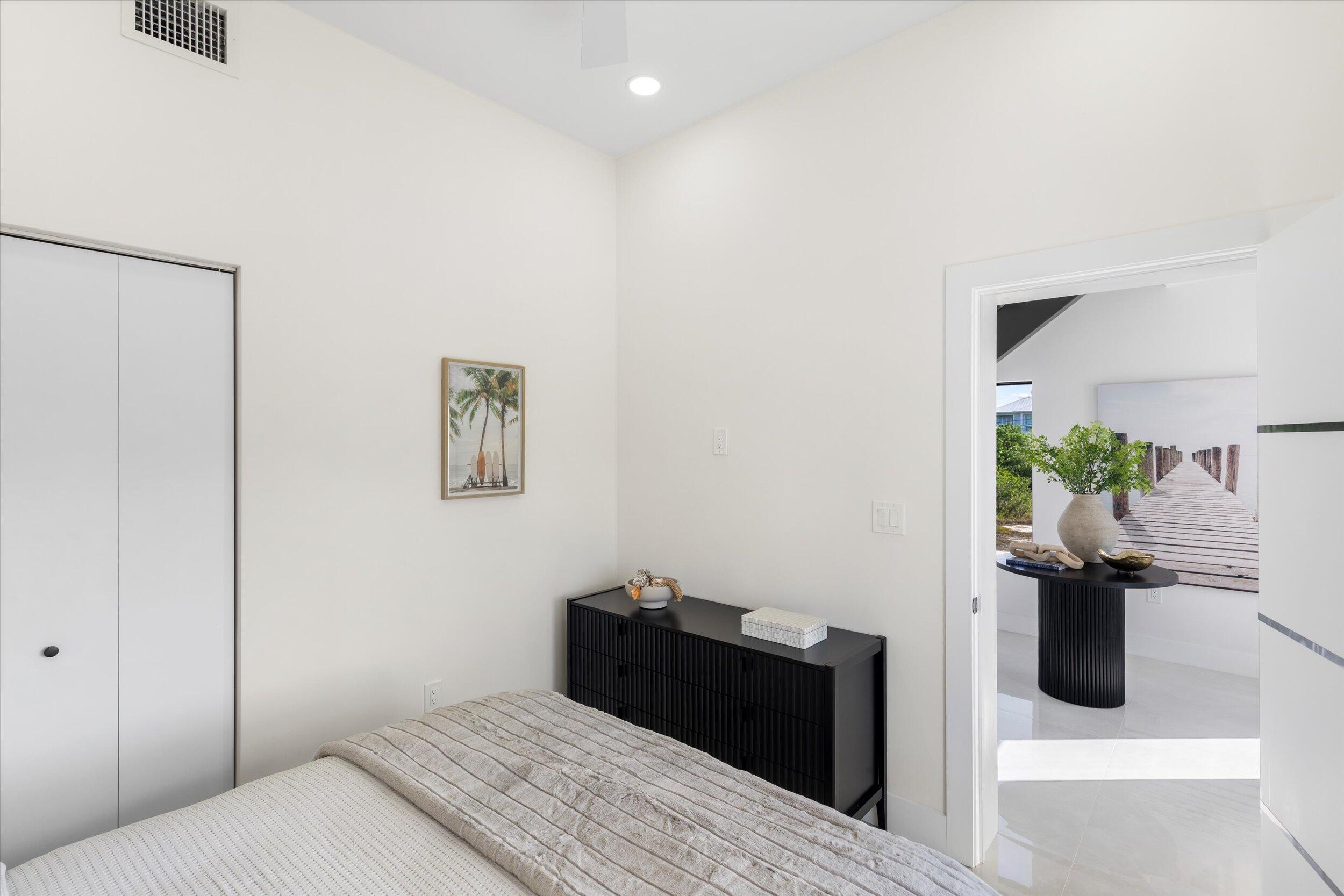 27433 Antigua Road Summerland Key, FL 33042 - Photo 9 of 64 a bedroom with a bed and a potted plant
