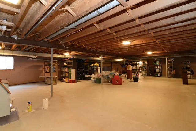a view of an empty room with a garage