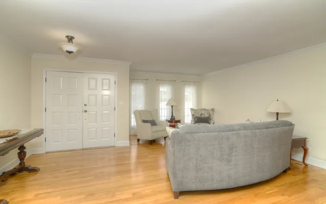 a living room with furniture and a area