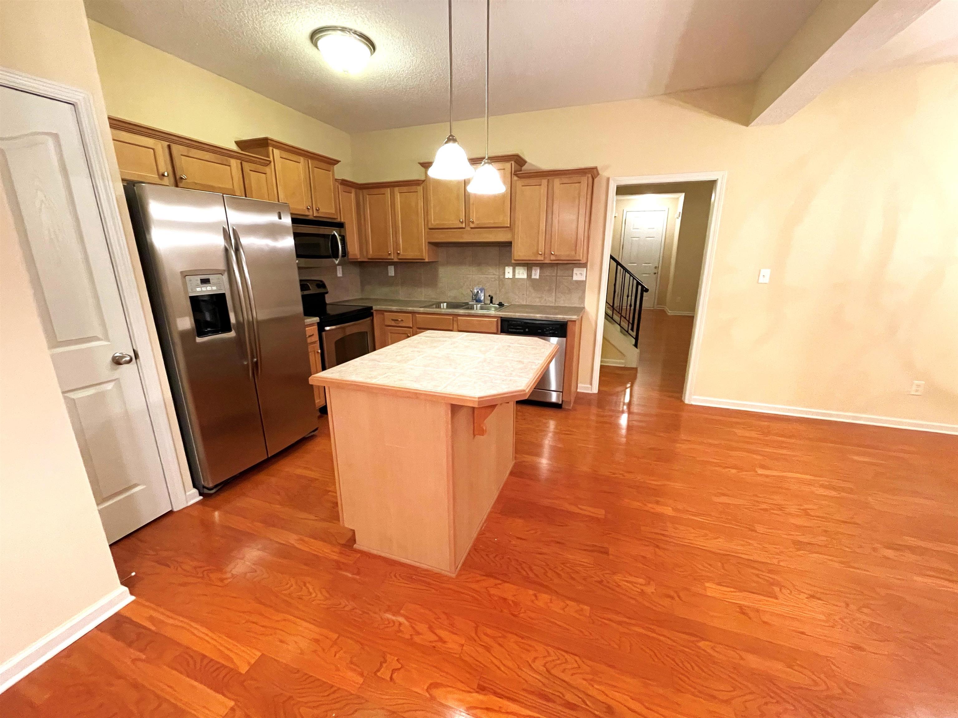 4965 Shaws Ridge Trail Arlington, TN 38002 - Photo 6 of 19 a kitchen with stainless steel appliances a refrigerator sink and microwave