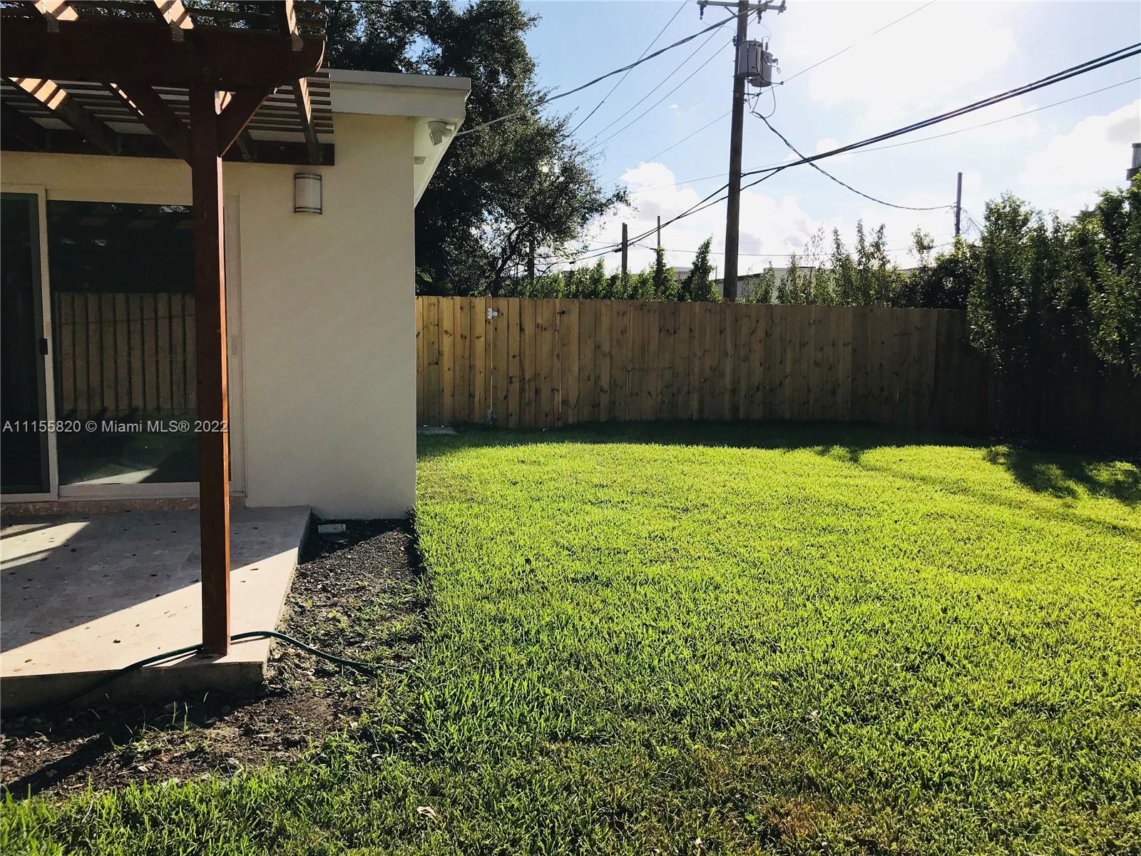 11720 Southwest 81st Road, Unit 11720 Pinecrest, FL 33156 - Photo 15 of 33 a view of backyard with tree