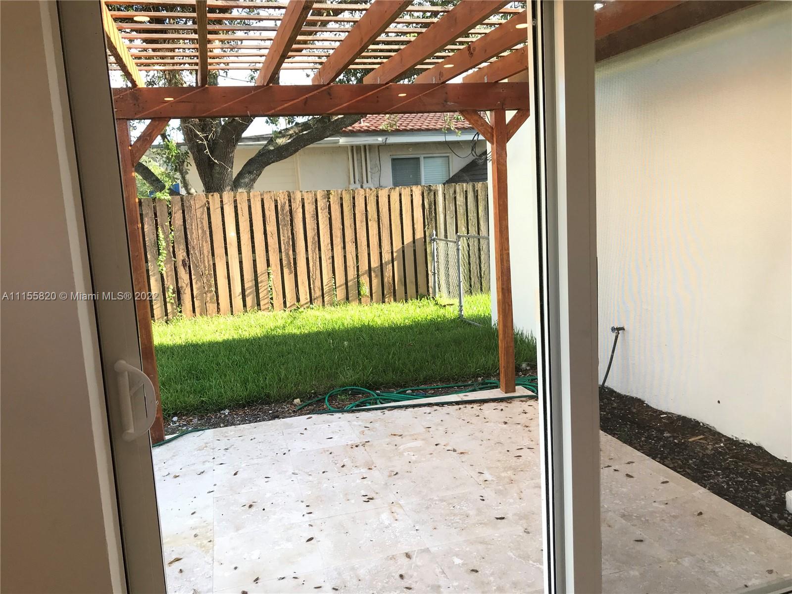 11720 Southwest 81st Road, Unit 11720 Pinecrest, FL 33156 - Photo 17 of 33 a view of outdoor space