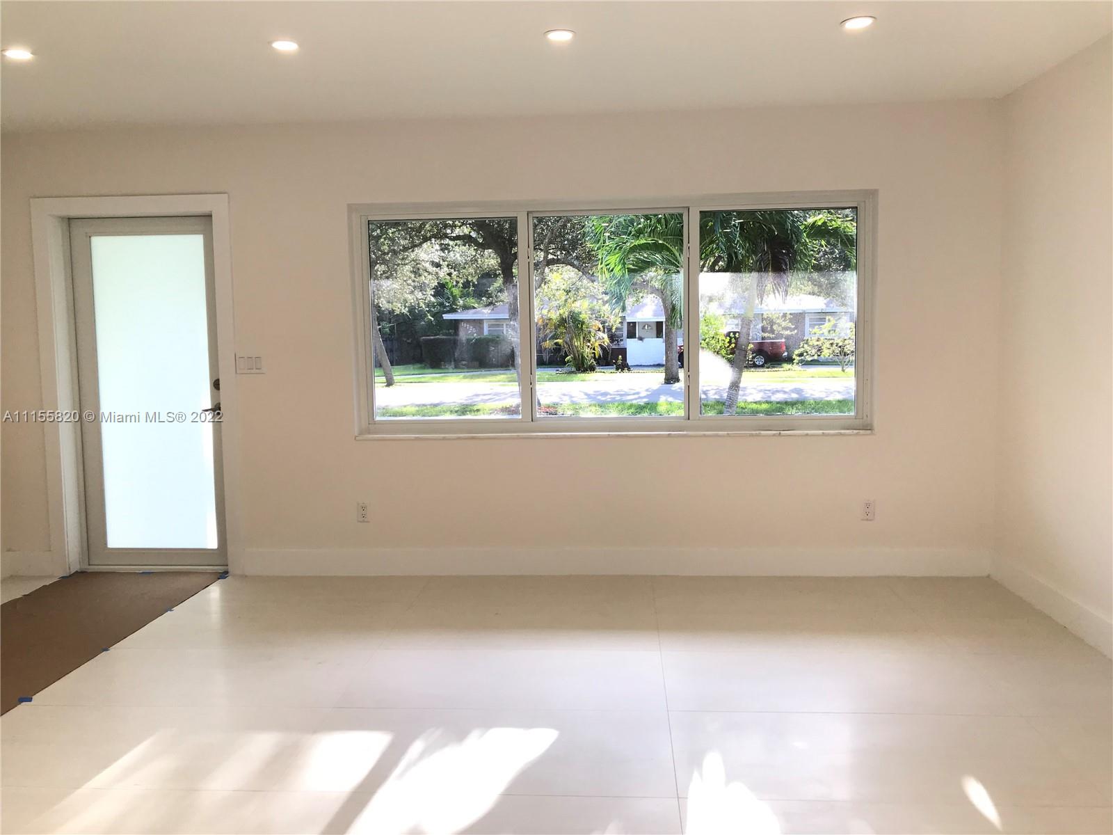 11720 Southwest 81st Road, Unit 11720 Pinecrest, FL 33156 - Photo 18 of 33 an empty room with a window