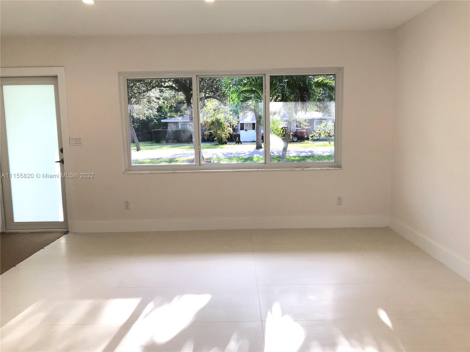 11720 Southwest 81st Road, Unit 11720 Pinecrest, FL 33156 - Photo 20 of 33 an empty room with a window