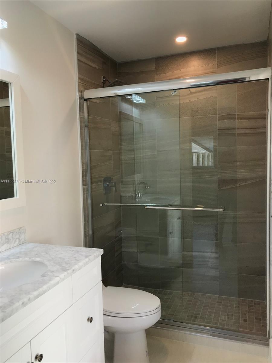 11720 Southwest 81st Road, Unit 11720 Pinecrest, FL 33156 - Photo 22 of 33 a bathroom with a shower and a toilet