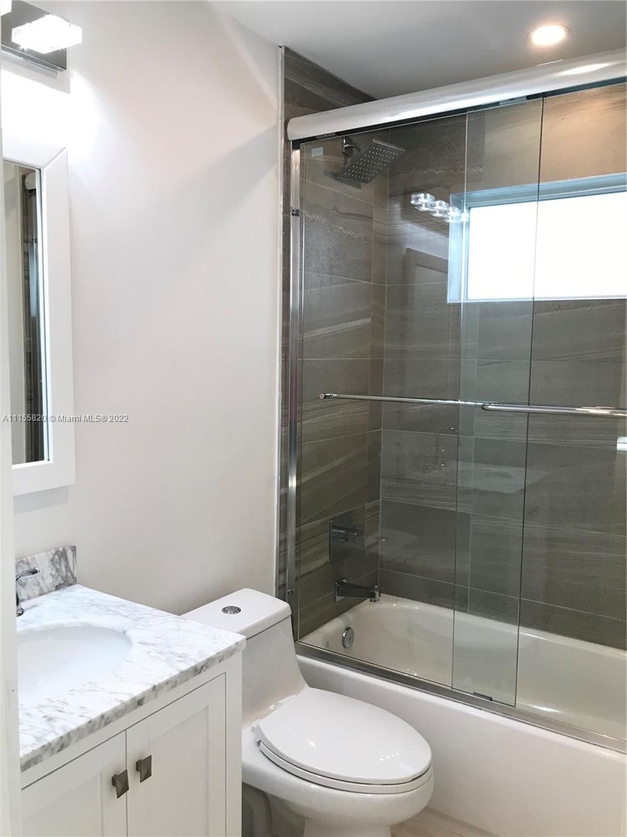 11720 Southwest 81st Road, Unit 11720 Pinecrest, FL 33156 - Photo 24 of 33 a bathroom with a sink a toilet and shower