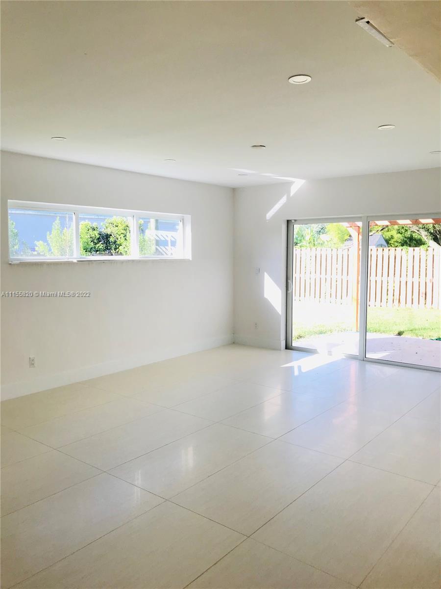 11720 Southwest 81st Road, Unit 11720 Pinecrest, FL 33156 - Photo 3 of 33 a view of an empty room with a window