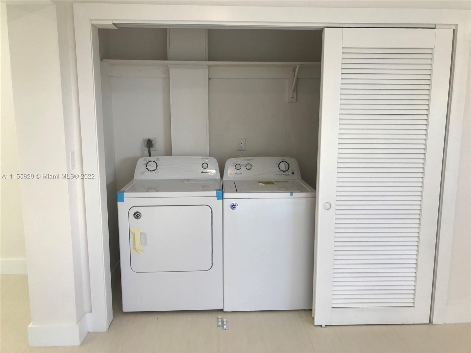 11720 Southwest 81st Road, Unit 11720 Pinecrest, FL 33156 - Photo 31 of 33 a utility room with dryer and washer