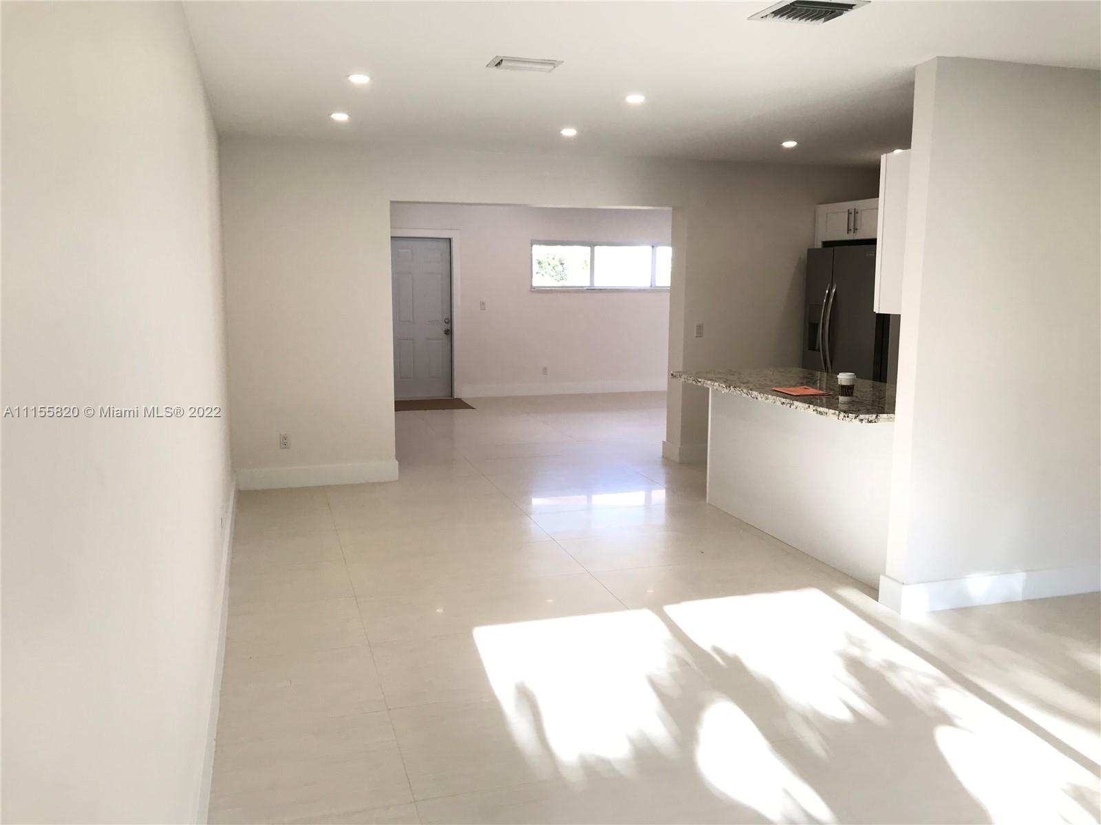 11720 Southwest 81st Road, Unit 11720 Pinecrest, FL 33156 - Photo 32 of 33 a view of an empty room and window