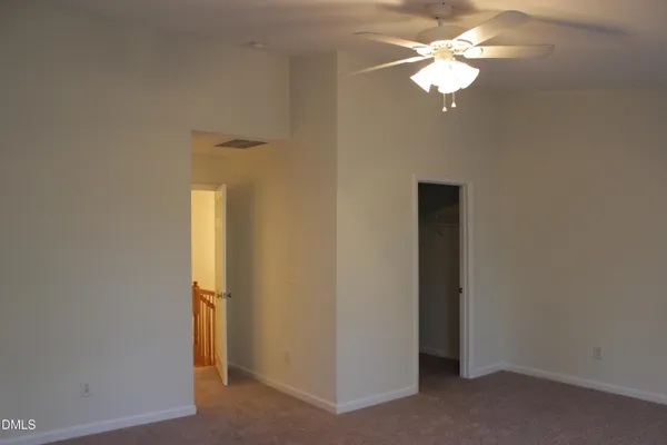 a view of a livingroom with a chandelier fan