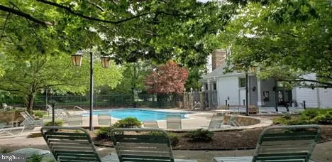 a view of a house with a window and wooden fence