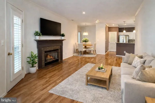 a kitchen with stainless steel appliances granite countertop a refrigerator a sink and a stove