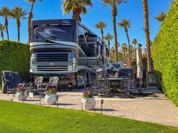 a view of a chairs and table in the patio