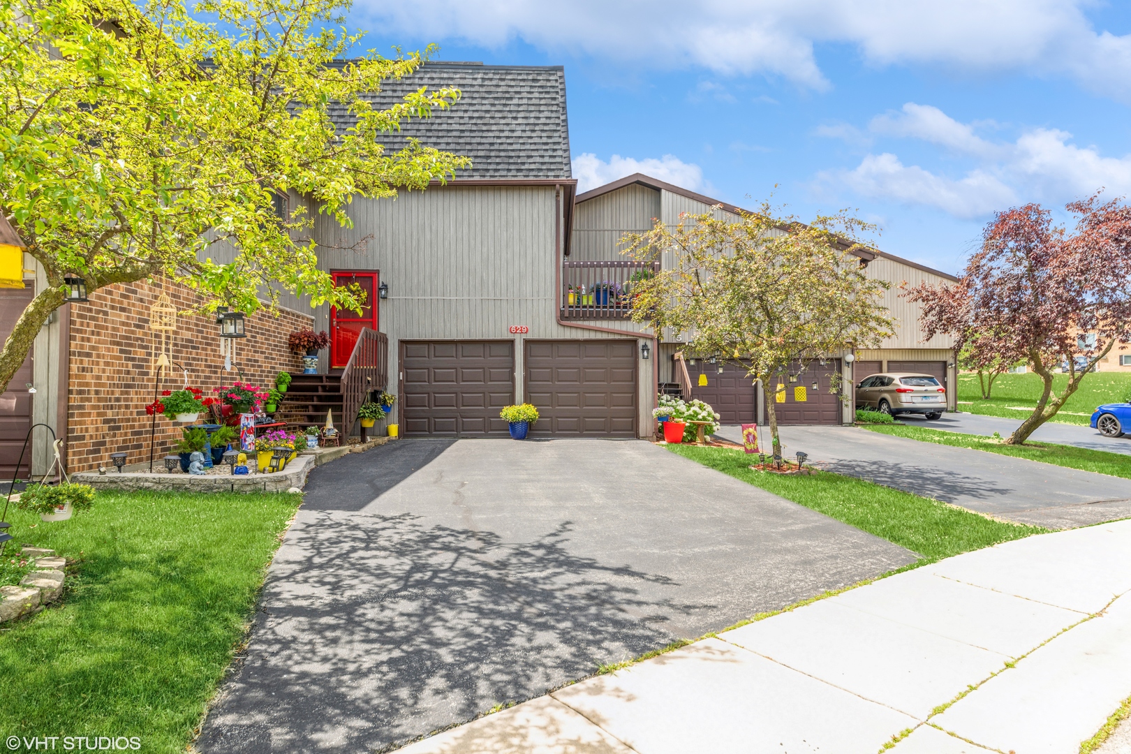 a front view of a house with a yard and garage