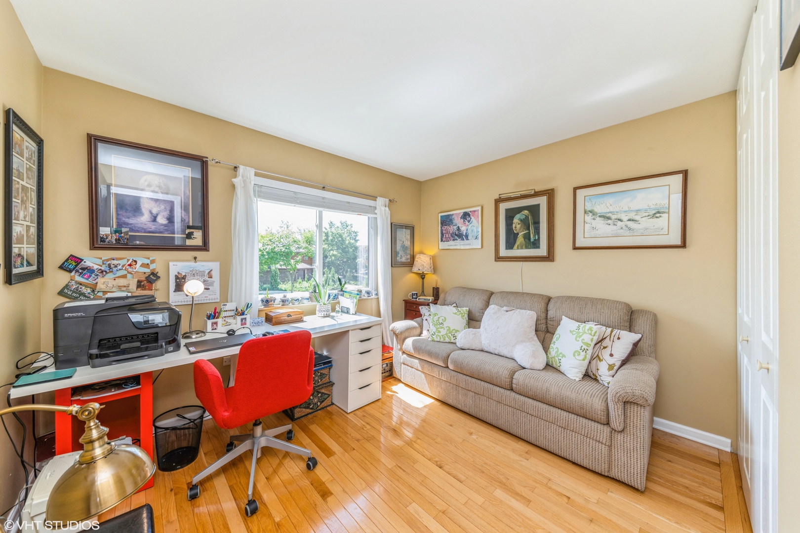 629 High Ridge Road Roselle, IL 60172 - Photo 12 of 20 a living room with furniture a flat screen tv and a window