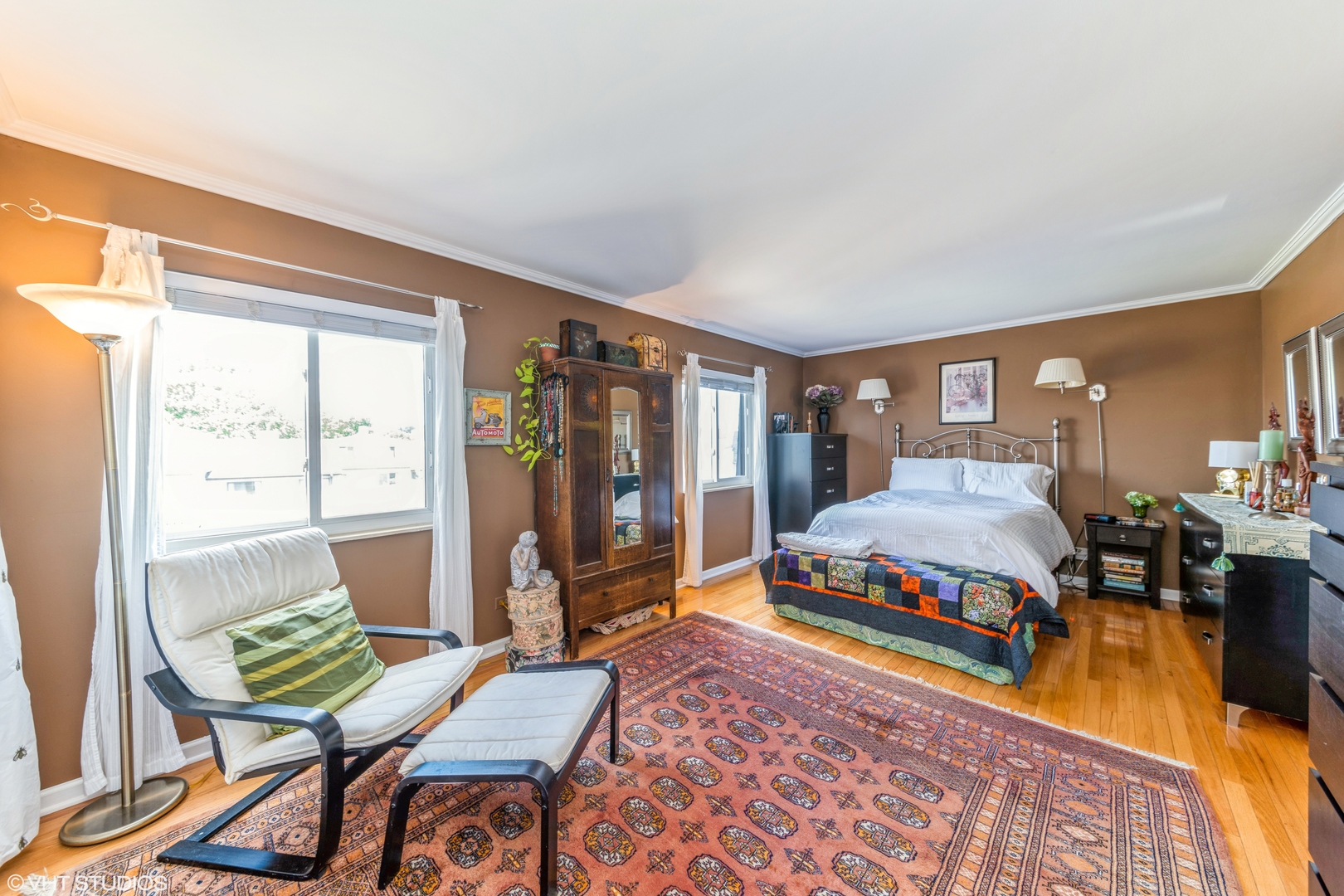 629 High Ridge Road Roselle, IL 60172 - Photo 14 of 20 a bedroom with a bed and wooden floor