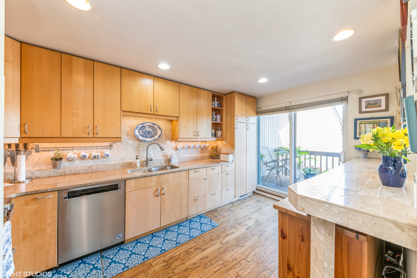 629 High Ridge Road Roselle, IL 60172 - Photo 7 of 20 a kitchen with stainless steel appliances granite countertop sink window and cabinets